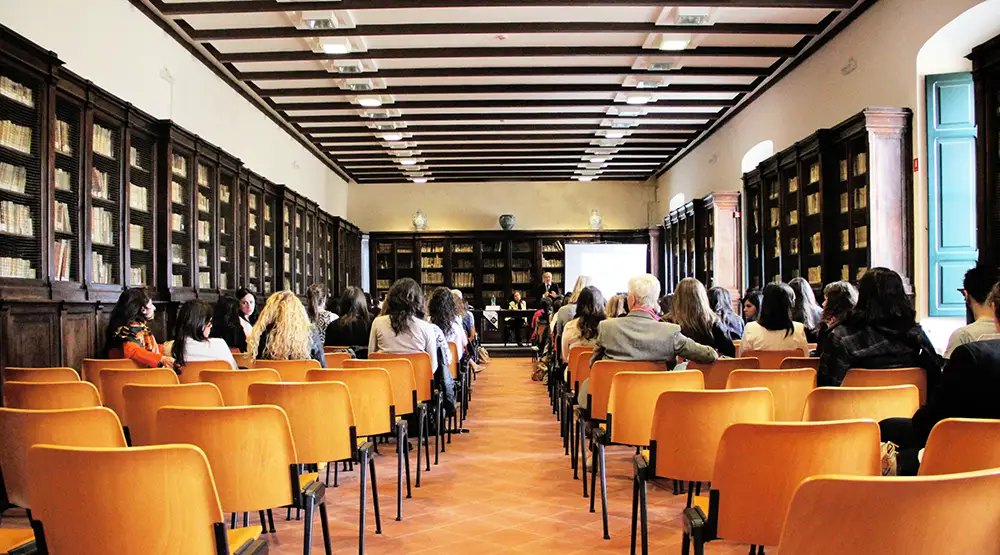 Classroom setting with adults facing a teacher
