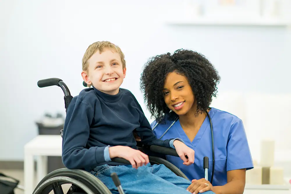 Nurse with a child in a wheelchair